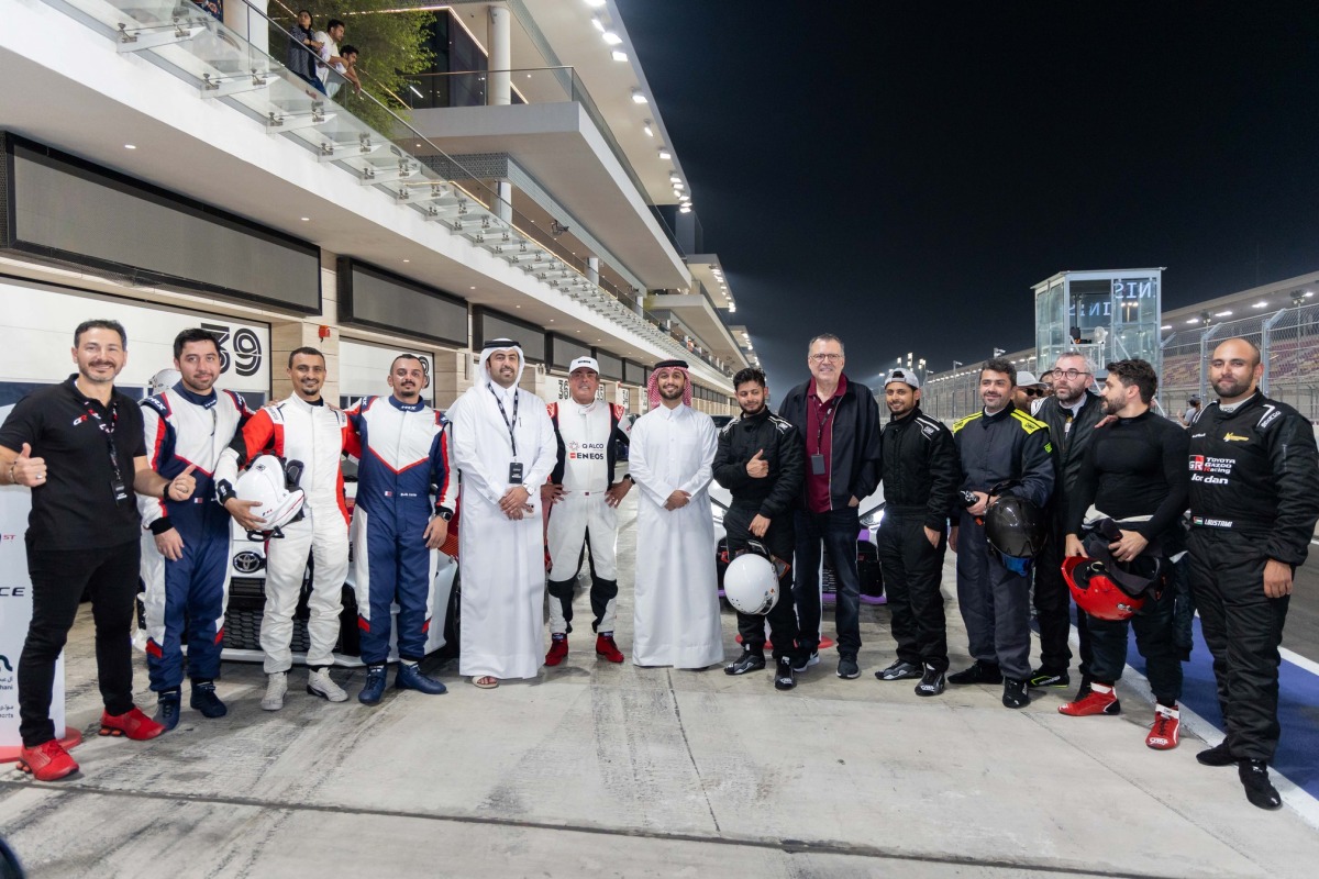 Al Abdulghani Motors CEO Abdulghani Nasser Al Abdulghani poses for a photograph with officials and drivers.