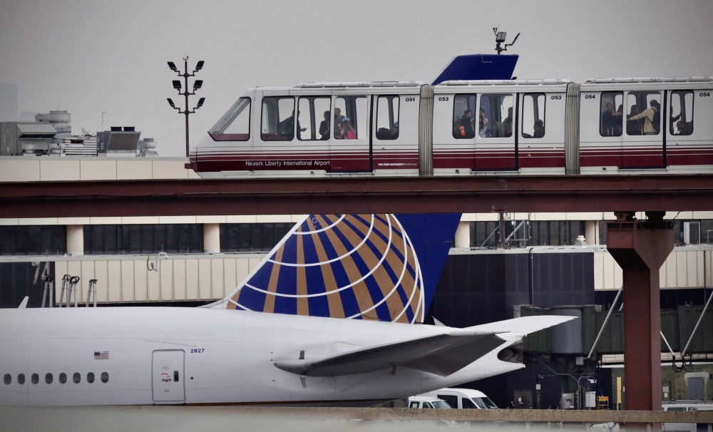 Passengers ride the air train at Newark Liberty International Airport in Newark, New Jersey on May 7, 2025. (Photo by Kena Betancur / AFP)