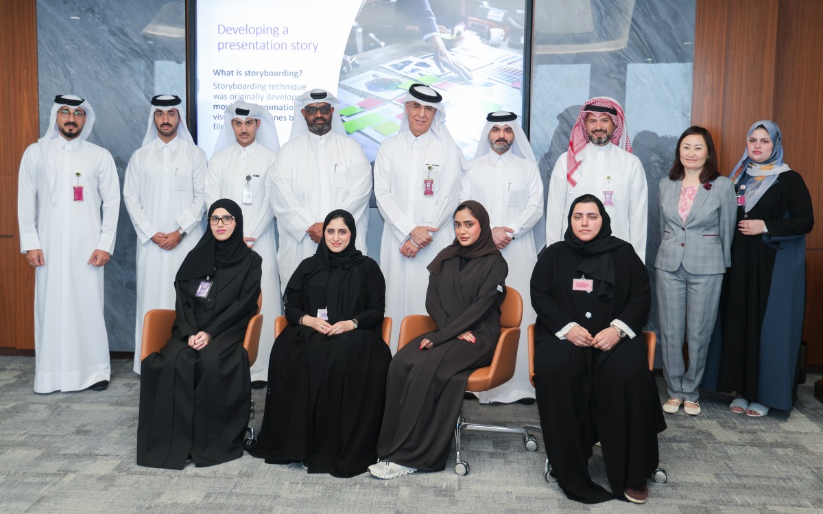 Officials pose for a group photo during the visit to Commercial Bank Plaza.