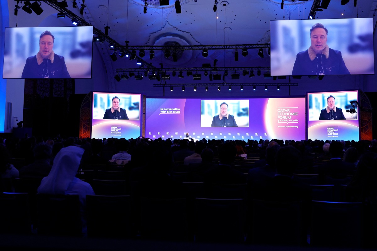 Elon Musk speaks at the Qatar Economic Forum in Doha on May 20, 2025. (Photo by Karim JAAFAR / AFP)
