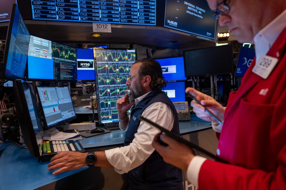 Traders work on the floor of the New York Stock Exchange (NYSE) on May 19, 2025 in New York City. (Photo by Spencer Platt/Getty Images/AFP)