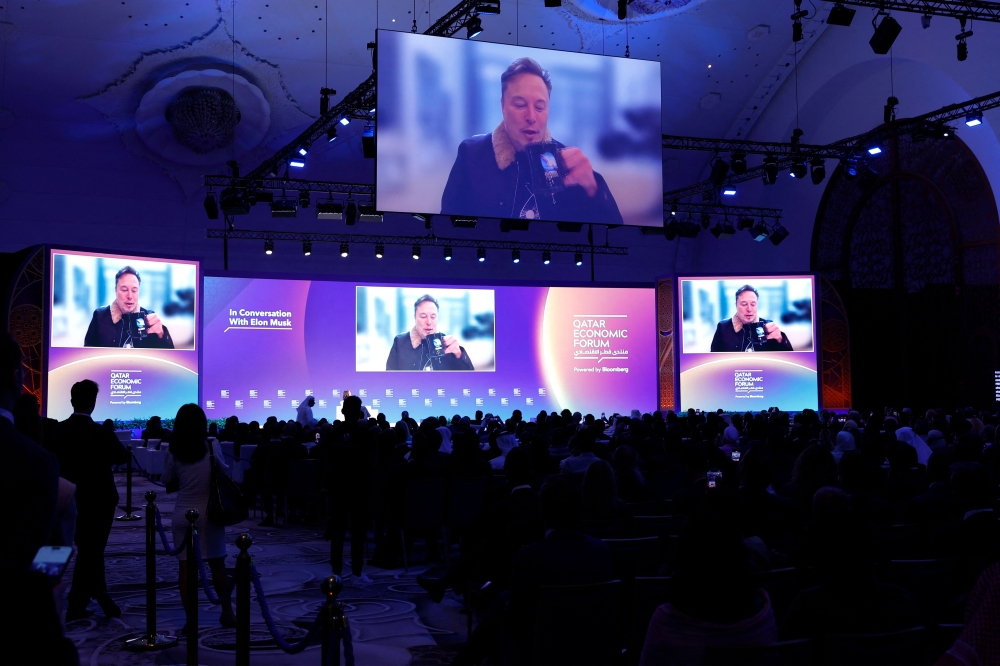 Elon Musk speaks at the Qatar Economic Forum in Doha on May 20, 2025. (Photo by Karim Jaafar / AFP)