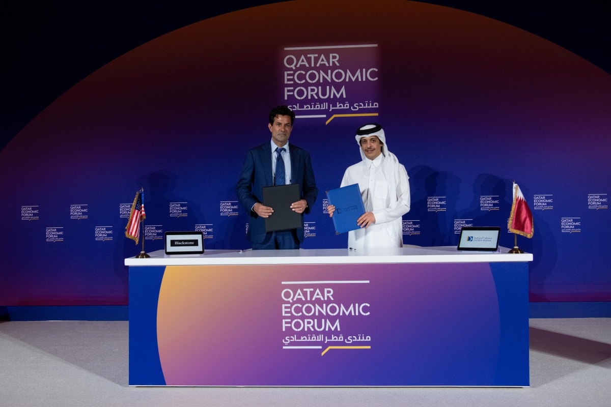 Officials during the signing ceremony at Qatar Economic Forum.