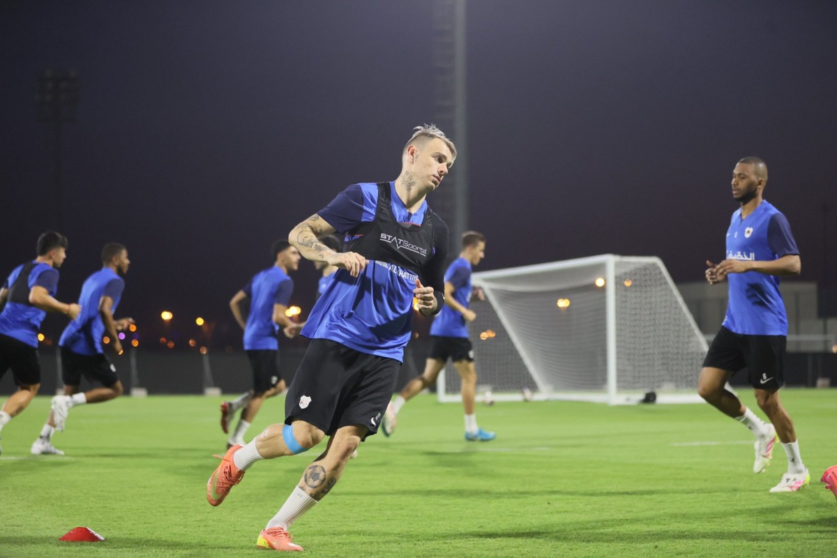 Al Rayyan's Roger Guedes trains with teammates yesterday.