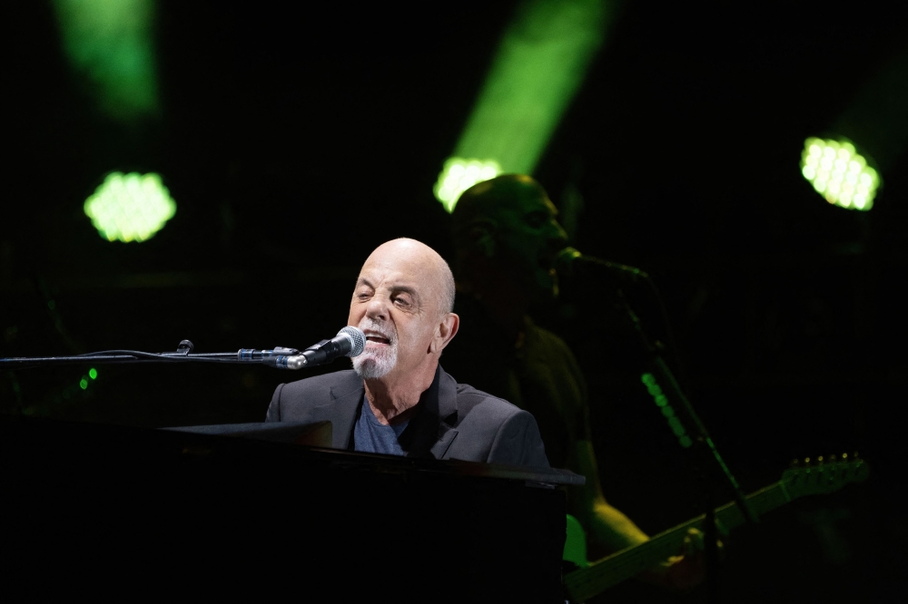 File: US musician Billy Joel performs during a concert at the Formula One Grand Prix at Circuit of the Americas in Austin, Texas on October 23, 2021. (Photo by Suzanne Cordeiro / AFP)