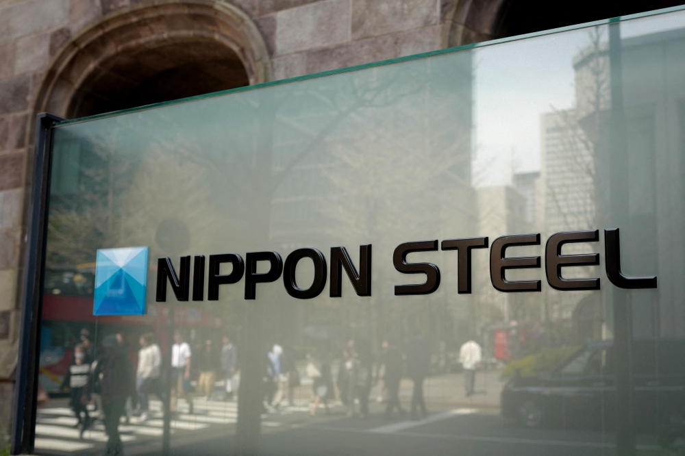 (Files) The logo of Japan's largest steel manufacturer Nippon Steel corporation is seen in front of the company's head office in Tokyo on April 10, 2025. (Photo by Kazuhiro Nogi / AFP)