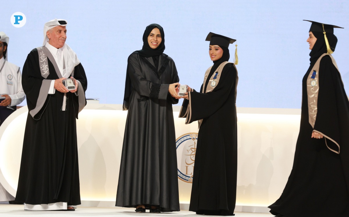 Minister of Education and Higher Education H E Lolwah bint Rashid Al Khater honouring a graduate of Lusail University. Pic: Rajan Vadakkemuriyil/The Peninsula 