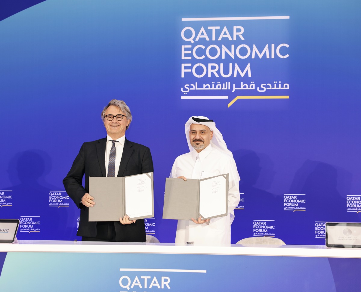 QFC CEO Yousuf Mohamed Al-Jaida and Ashmore Group CEO, Mark Coombs, during the MoU signing at QEF 2025.