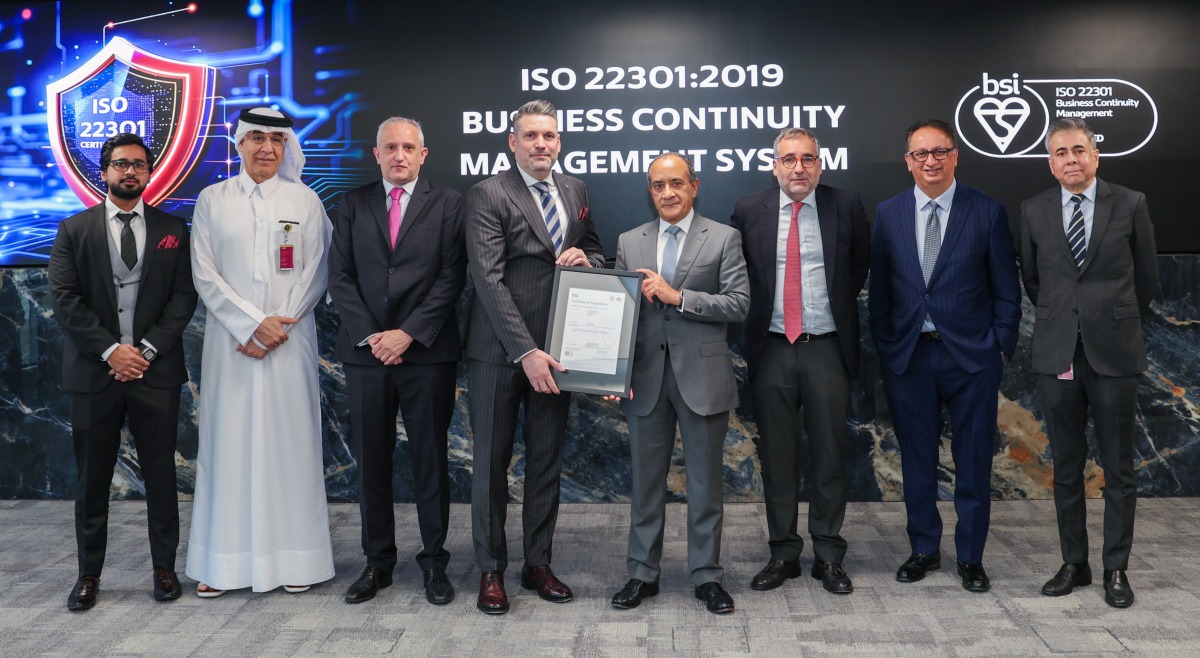 Group Chief Executive Officer at Commercial Bank Joseph Abraham receving the prestigious ISO 22301 certification for Business Continuity Management Systems along with other officials.