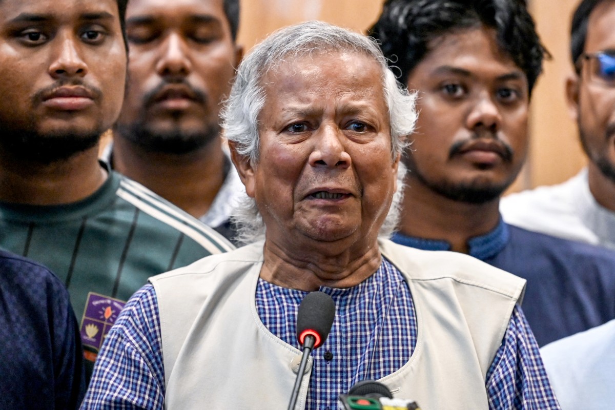 Nobel laureate Muhammad Yunus (C) speaks during a press conference upon his arrival at the Hazrat Shahjalal International Airport in Dhaka on August 8, 2024. (Photo by Munir UZ ZAMAN / AFP)