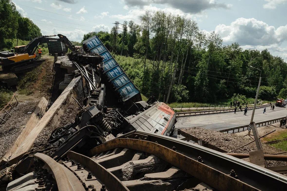 This handout photograph posted on the Telegram account of Kursk region acting governor Alexander Khinshtein (Telegram/@Hinshtein) on June 1, 2025 shows a damaged freight train at the site of a railway bridge collapse in the Kursk region. (Photo by Handout / Telegram/@Hinshtein / AFP)