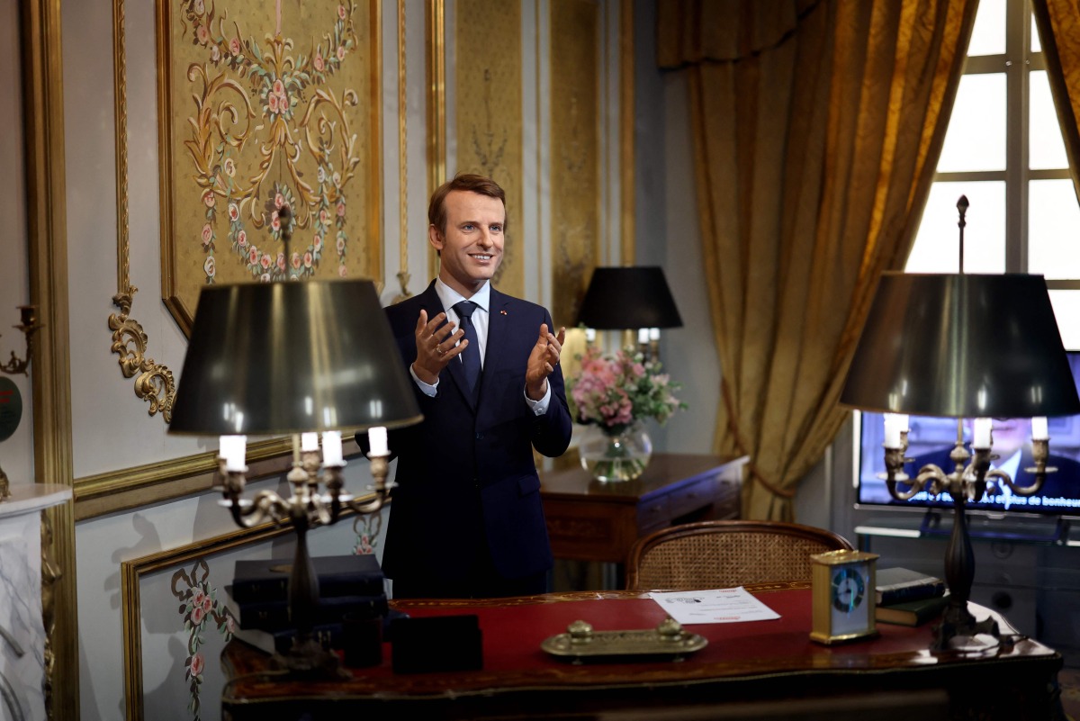 (FILES) A wax statue of French President Emmanuel Macron is seen at the Musee Grevin in Paris on June 2, 2022.(Photo by Thomas COEX / AFP)