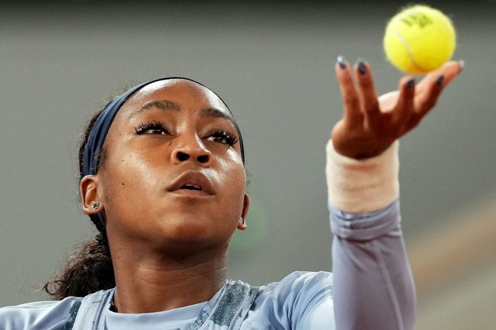 US Coco Gauff serves to US Madison Keys during their women's singles quarter-final match on day 11 of the French Open tennis tournament on Court Philippe-Chatrier at the Roland-Garros Complex in Paris on June 4, 2025. (Photo by Dimitar Dilkoff / AFP)