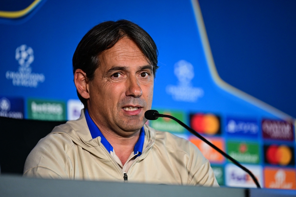 (Files) Inter Milan's Italian coach Simone Inzaghi gives a press conference ahead of the UEFA Champions League final football match against Paris Saint-Germain (PSG) as part of the club's media day in Appiano Gentile, Italy, on May 26, 2025. (Photo by Piero Cruciatti / AFP)