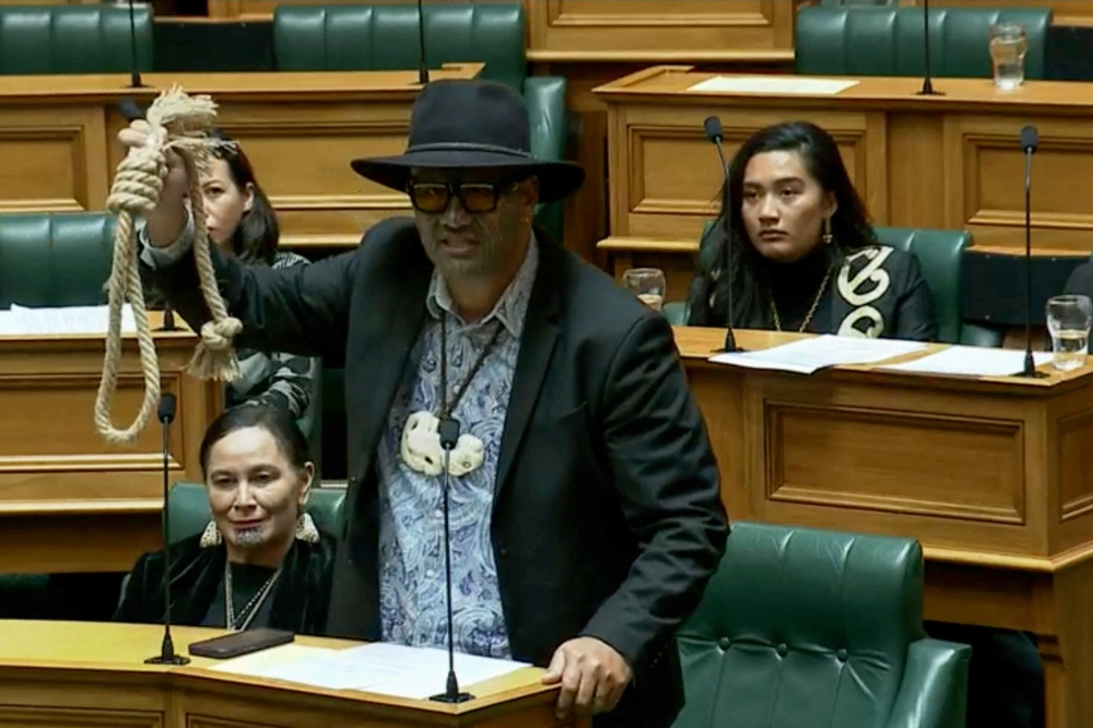 This screen grab taken from video released by the New Zealand Parliament on June 5, 2025 shows Maori Party co-leader Rawiri Waititi holding a noose while speaking at the parliament in Wellington. (Photo by Handout / New Zealand Parliament / AFP)