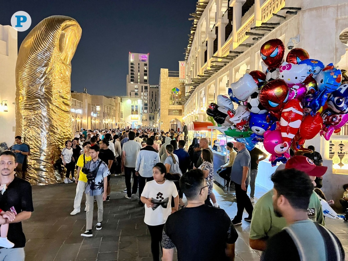 Families exchange laughter and treats while children pursue balloons and lanterns illuminate the scene, creating lasting memories beneath Qatar's starry sky on third day of Eid Al-Adha yesterday. Pic: Amr Diab/The Peninsula.
