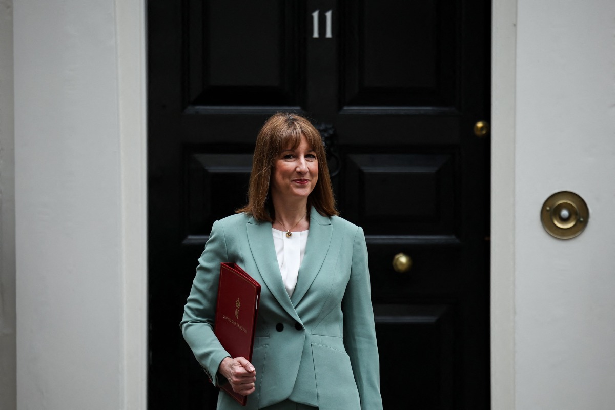 Britain's Chancellor of the Exchequer Rachel Reeves leaves from 11 Downing Street in central London, on June 11, 2025, before heading to Parliament to present her Spending Review. (Photo by HENRY NICHOLLS / AFP)
