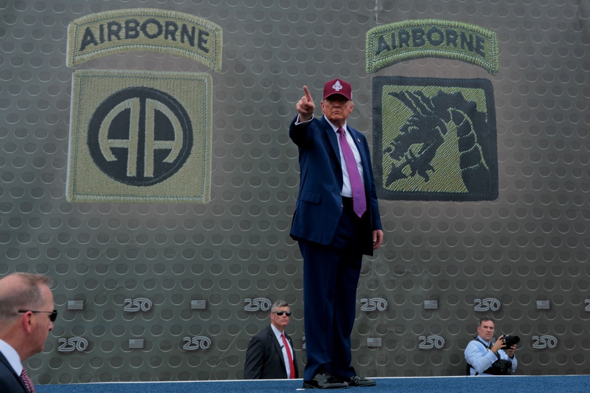 US President Donald Trump pumps his fist as he leaves the stage during a rally with U.S. Army troops on June 10, 2025 at Fort Bragg, North Carolina. (Photo by Anna Moneymaker / GETTY IMAGES NORTH AMERICA / Getty Images via AFP)
