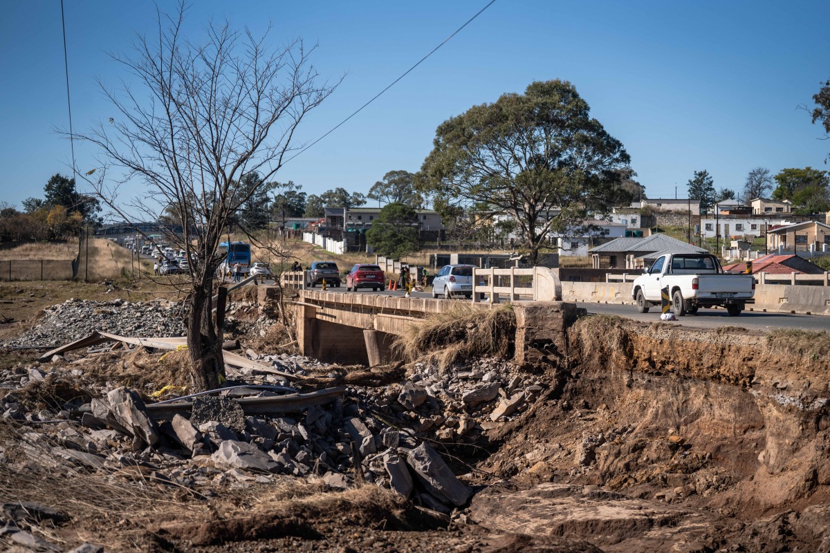 This photo taken on June 13, 2025 shows a flood-damaged bridge where a scholar transport minibus carrying 11 school children and 2 adults was swept away during the floods in Mthatha, Eastern Cape Province, South Africa. (Photo by Johan Van Eeden/Xinhua)