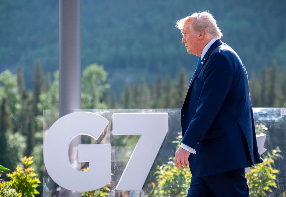 US President Donald Trump arrives for a family photo during the Group of Seven (G7) Summit at the Kananaskis Country Golf Course in Kananaskis, Alberta, Canada on June 16, 2025. (Photo by Michael Kappeler / POOL / AFP)