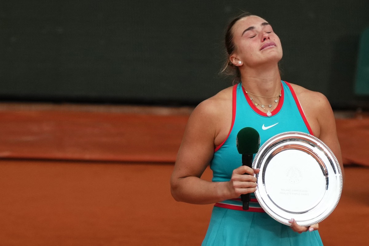 Belarus' Aryna Sabalenka reacts as she poses with her trophy after being defeated by US Coco Gauff in Paris on June 7, 2025. (Photo by Dimitar Dilkoff / AFP)