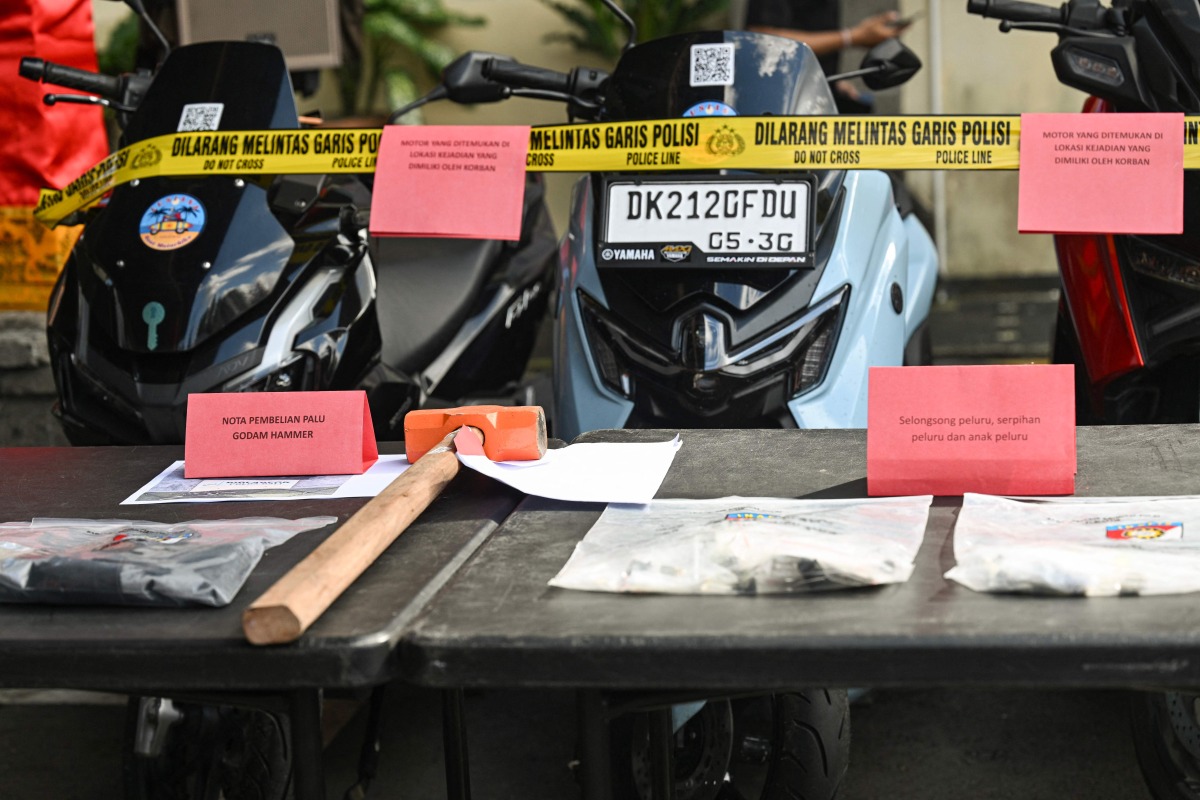 Evidence seized from the suspects allegedly involved in the murder of an Australian man at a Bali villa are seen on display during a press conference at the Badung district police station in Badung regency on Indonesia's resort island of Bali on June 18, 2025. Photo by Sonny Tumbelaka / AFP