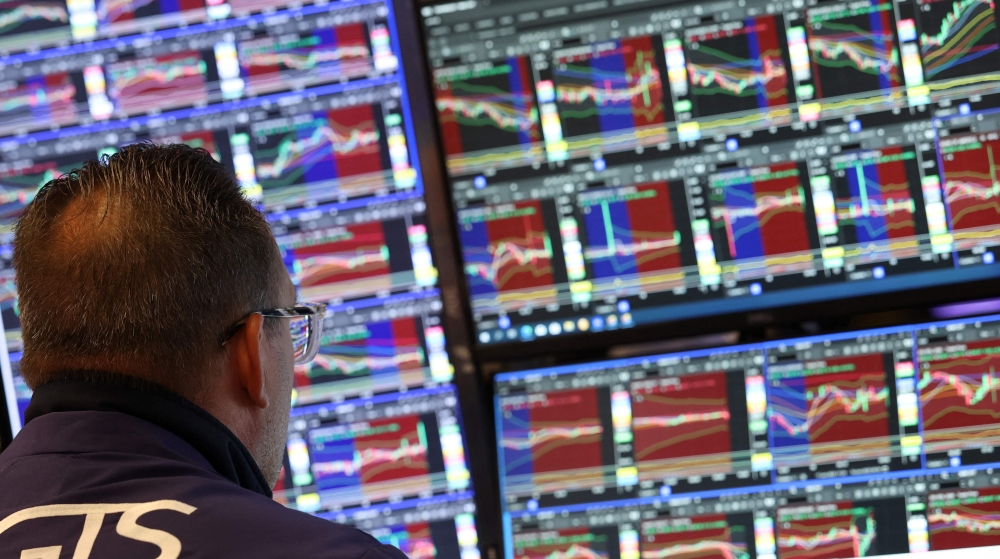 Traders work on the floor of the New York Stock Exchange (NYSE) at the in New York City on June 18, 2025. (Photo by Timothy A Clary / AFP)