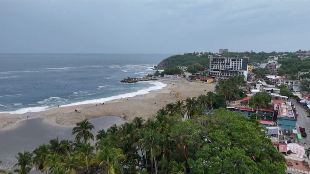 This frame grab from AFPTV video footage shows the popular tourist town of Puerto Escondido as Hurricane Erick approaches Mexico's Pacific coast. (Photo by Carlo Echegoyen / AFPTV / AFP)