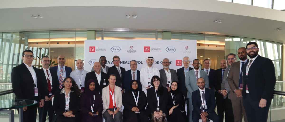 Participants with officials at the workshop.