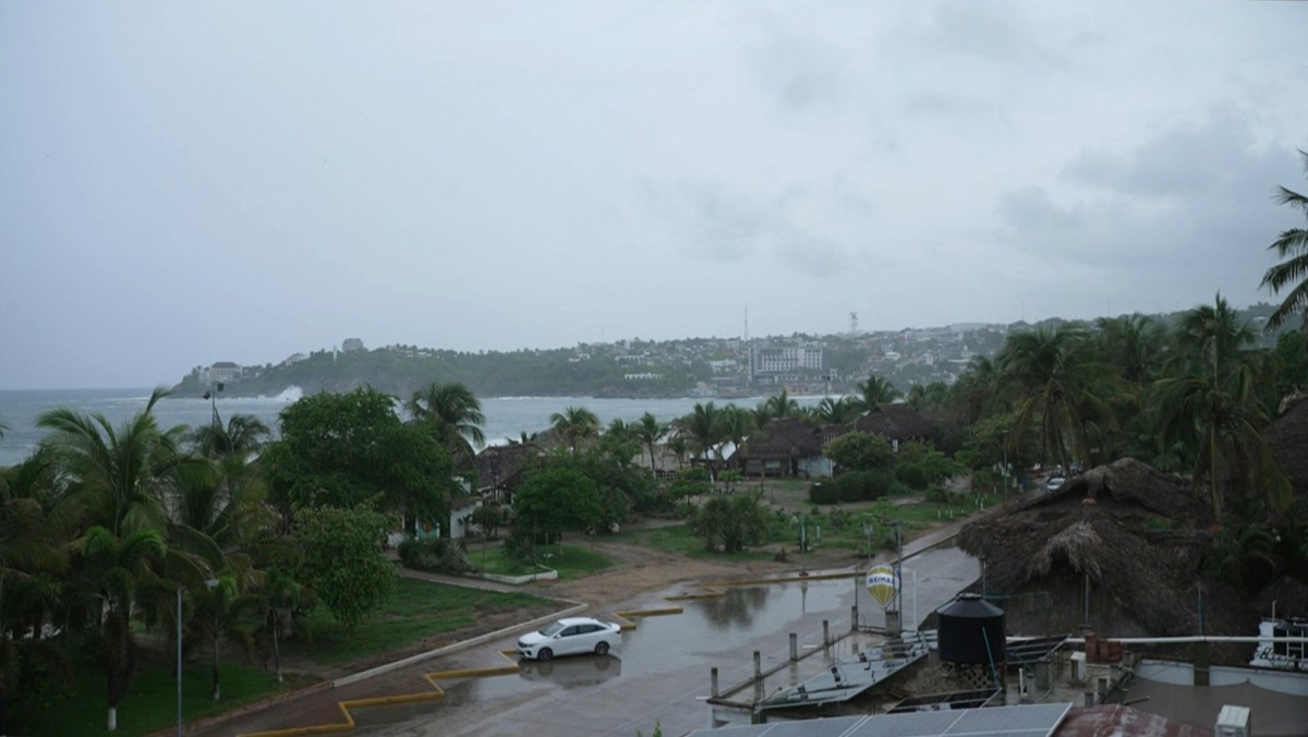 This frame grab from AFPTV video footage shows the popular tourist town of Puerto Escondido as Hurricane Erick approaches Mexico's Pacific coast as a powerful Category 3 storm in Oaxaca state, Mexico on June 18, 2025. Photo by Carlo ECHEGOYEN / AFPTV / AFP