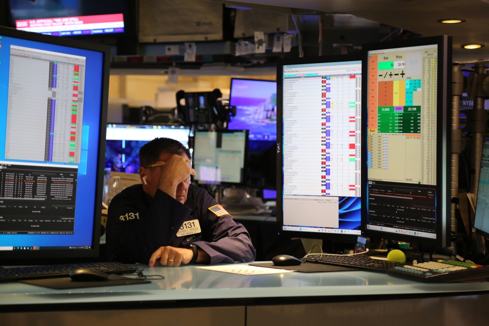 A trader is seen on the floor of the New York Stock Exchange in New York City, the United States. (Xinhua/Liu Yanan)