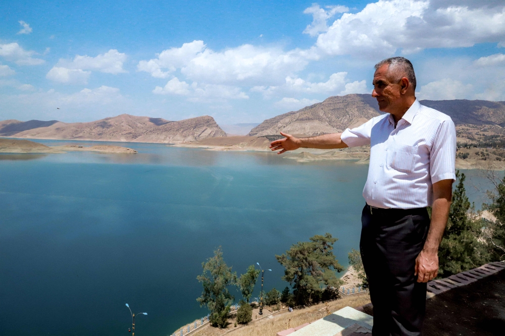 Kochar Jamal Tawfeeq, director of the Dukan Dam facility, by the reservoir northwest of Iraq's northeastern city of Sulaimaniyah in the autonomous Kurdistan region on June 4, 2025. (Photo by Shwan MOHAMMED / AFP)