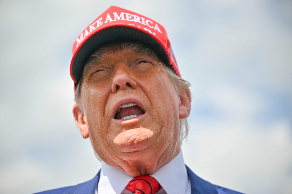 US President Donald Trump speaks to the press upon arrival at Morristown Municipal Airport in Morristown, New Jersey, on June 20, 2025. (Photo by Mandel NGAN / AFP)