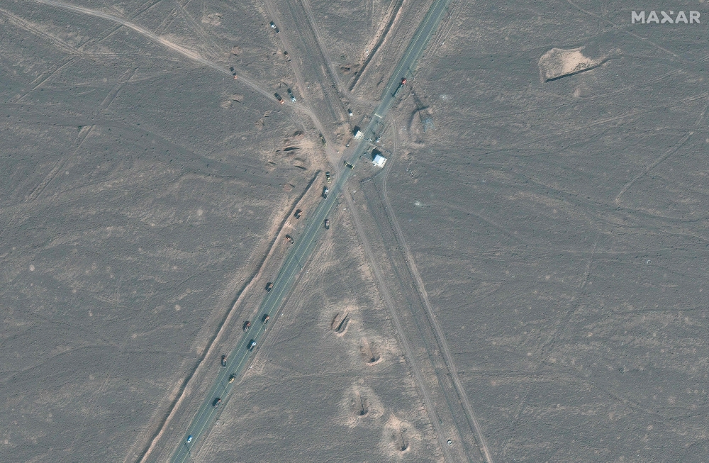 Handout satellite image courtesy of Maxar Technologies shows new vehicle revetments and trucks on road 1.1 km (0.6 miles) from Iran's Fordow Fuel Enrichment Plant (FFEP), in Fordo, Iran on June 20, 2025. (Photo by Satellite image 2025 Maxar Technologies / AFP) 