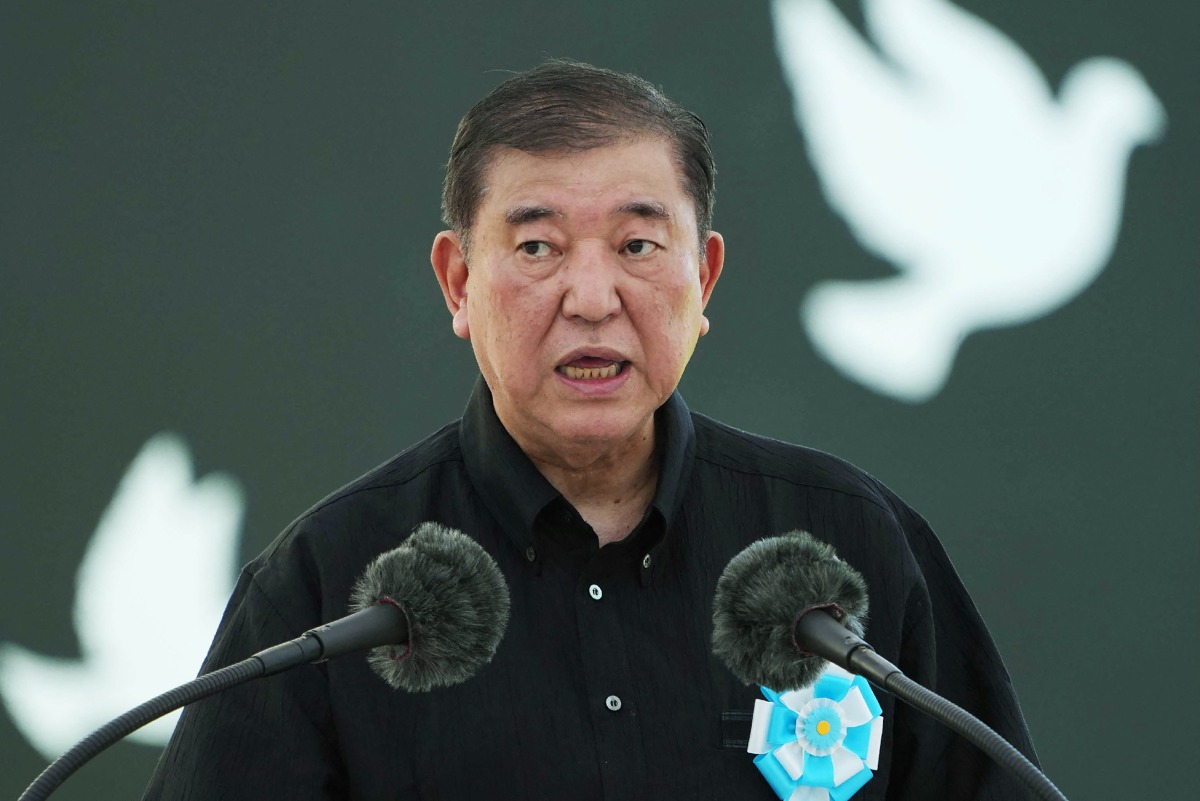 Photo used for representational purposes. Japan's Prime Minister Shigeru Ishiba delivers a speech during a remembrance ceremony to mark the 80th anniversary of the Battle of Okinawa, at the Peace Memorial Park in Itoman, Okinawa Prefecture on June 23, 2025. Photo by JIJI PRESS / AFP.
