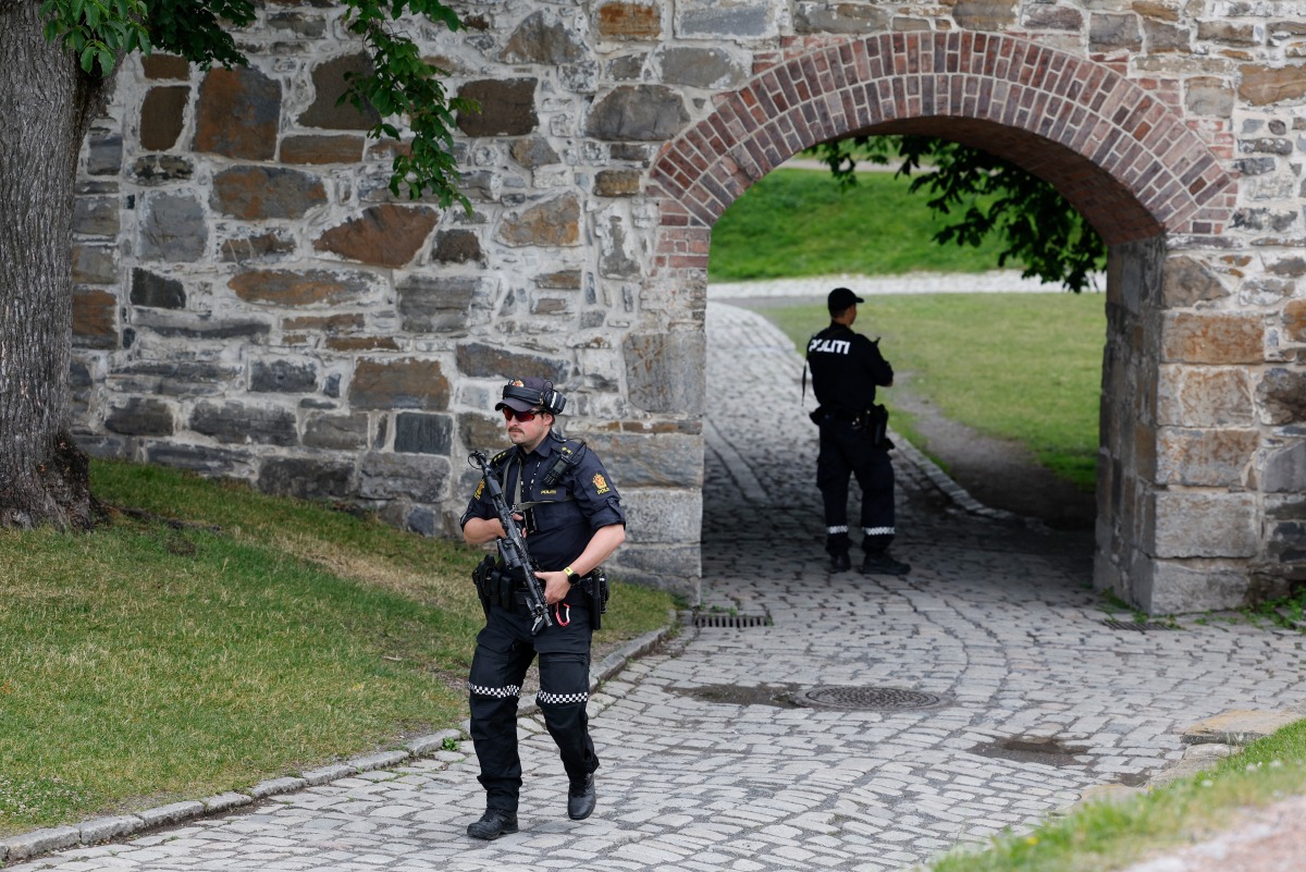 Photo used for representational purposes. Armed police officers patrol the grounds of Akershus Fortress ahead of the arrival of French President Emmanuel Macron (not in picture) who will meet with Norwegian Prime Minister in Oslo, Norway, on June 23, 2025. Photo by Odd ANDERSEN / AFP.