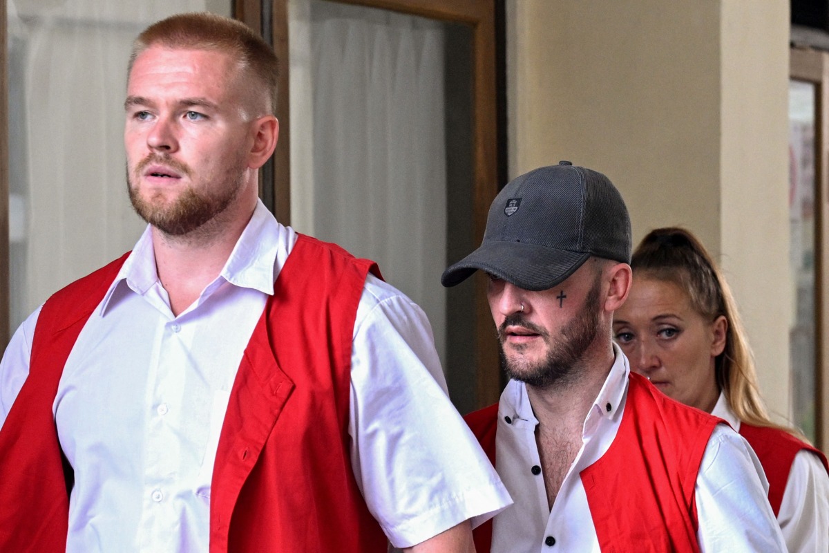 British nationals (L-R) Phineas Ambrose Float, Jonathan Christopher Collyer and Lisa Ellen Stocker are brought to court for their trial in Denpasar, Indonesia's Bali island on June 24, 2025. Photo by SONNY TUMBELAKA / AFP