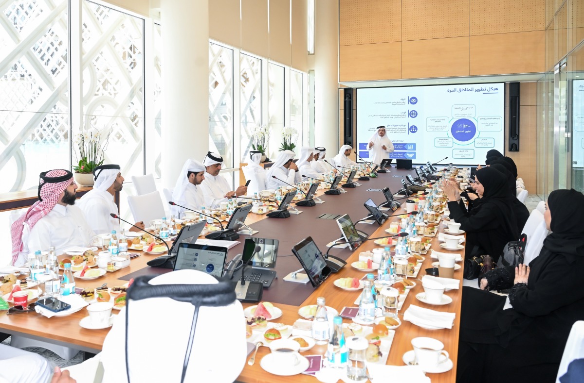 QFZ officials and delegates listen to a presentation during the visit.