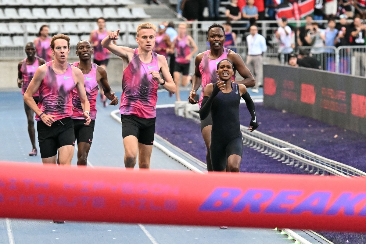 Kenya’s Faith Kipyegon (right) takes part in the 'Breaking4' event, in an attempt to become the first woman to run a mile in under four minutes, in Paris.