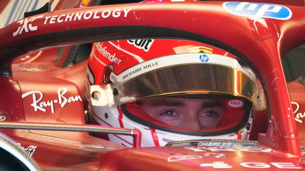 Ferrari's Monegasque driver Charles Leclerc sits in his car in the pits during the qualifying session at the Red Bull Ring race track in Spielberg, Austria, on June 28, 2025, ahead of the Formula One Austrian Grand Prix. (Photo by Darko Bandic / POOL / AFP)
