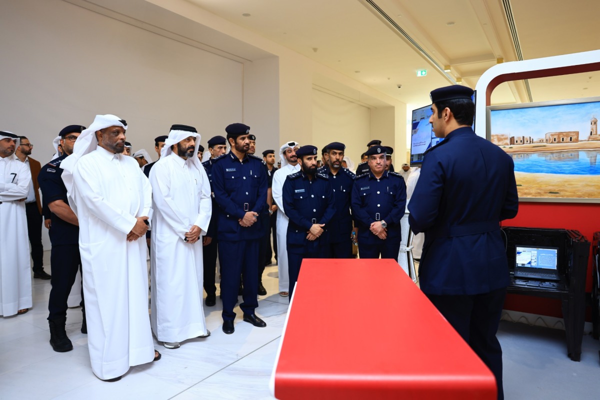 Officials at the exhibition being held at Place Vendome Mall in Lusail