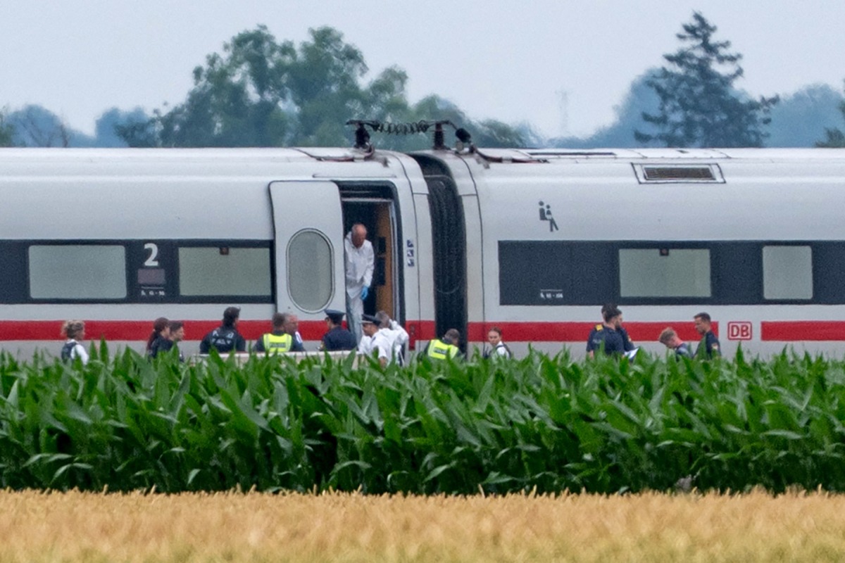 Police and forensic experts investigate a high-speed ICE train on July 3, 2025 near the village of Strasskirchen, Bavaria, after a man had attacked several passengers with 