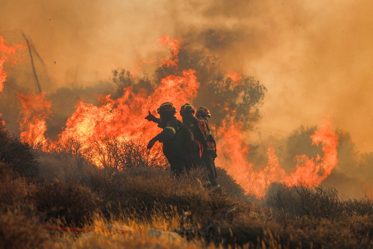 Firemen battle with a wildfire that broke out in Ierapetra at the southern Greek island of Crete, on July 3, 2025. Photo by Costas Metaxakis / AFP