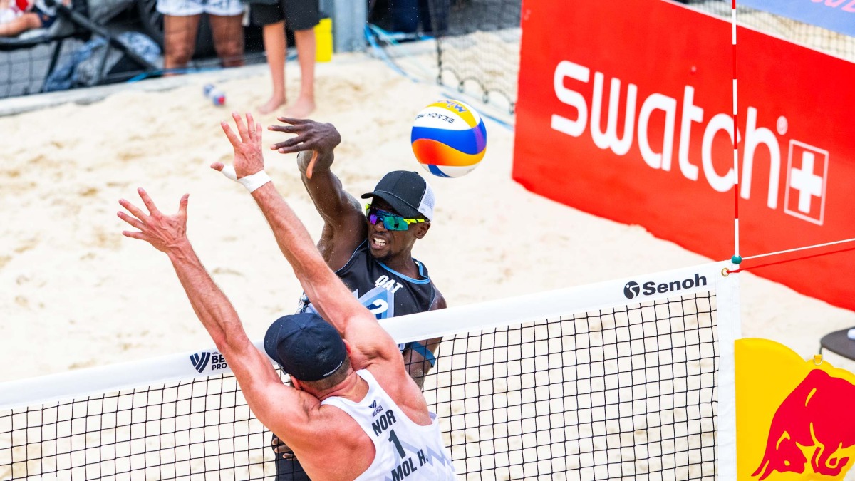 Qatar's Ahmed Tijan shoots to score. 