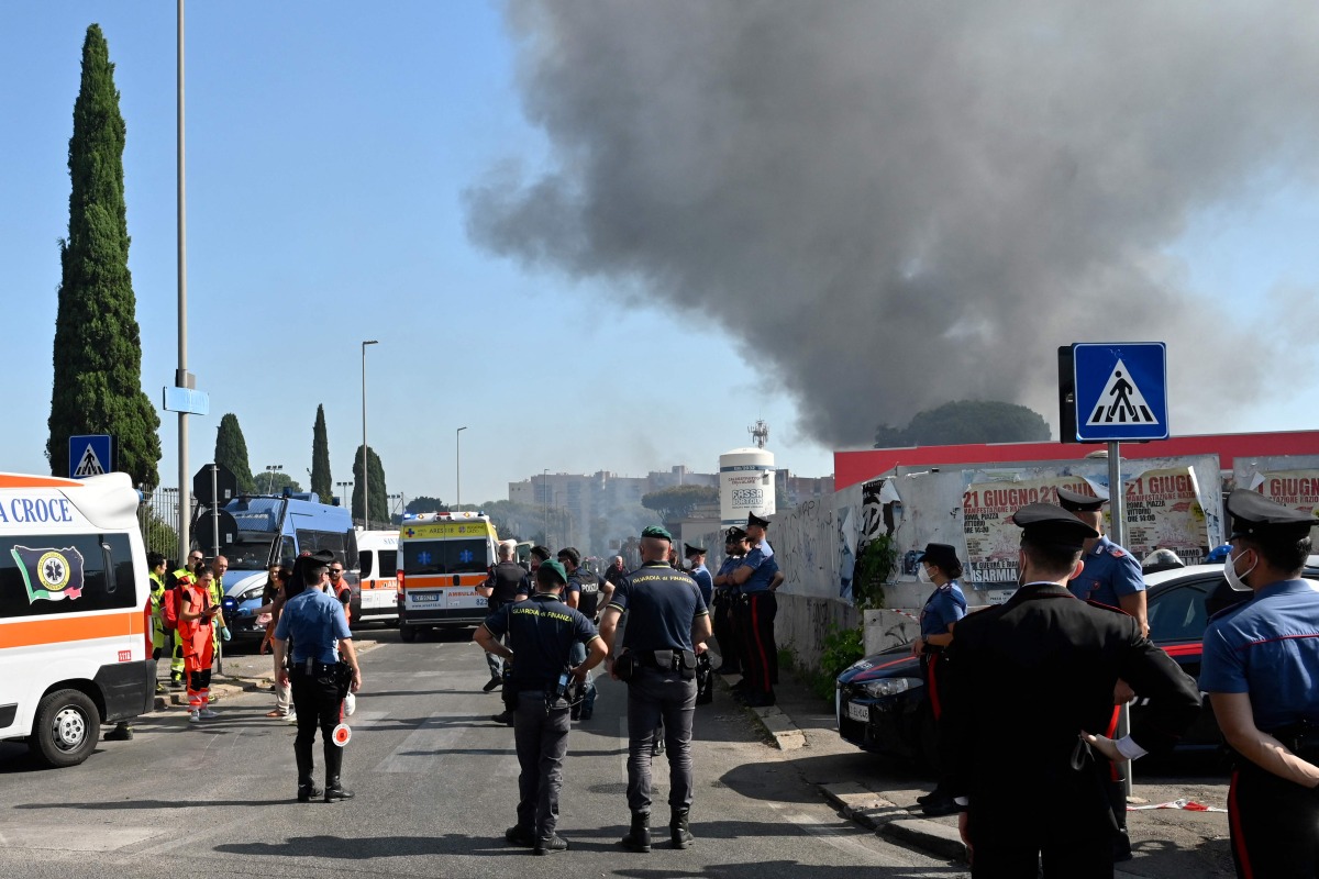 Firemen, policemen and rescue teams work on the site of an explosion in a fuel station in Rome on July 4, 2025. Photo by Andreas SOLARO / AFP