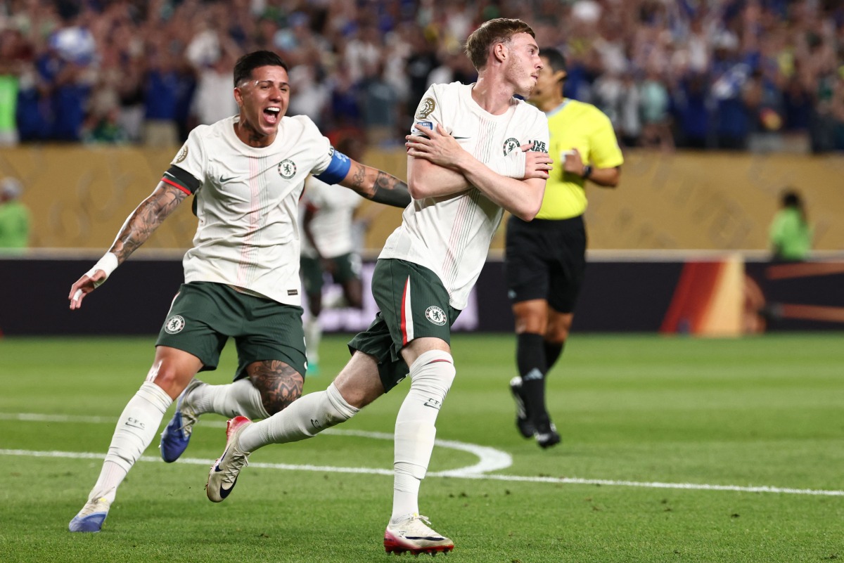 Chelsea's English midfielder #10 Cole Palmer (R) celebrates with teammate Argentinian midfielder #08 Enzo Fernandez (L) after scoring his team's first goal during the FIFA Club World Cup 2025 quarterfinal football match between Brazil's Palmeiras and England's Chelsea at the Lincoln Financial Field Stadium in Philadelphia on July 4, 2025. (Photo by FRANCK FIFE / AFP)