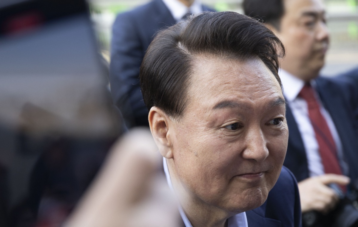 Ousted South Korean president Yoon Suk Yeol (L) leaves the official residence in Seoul on April 11, 2025. (Photo by JEON HEON-KYUN / POOL / AFP)

