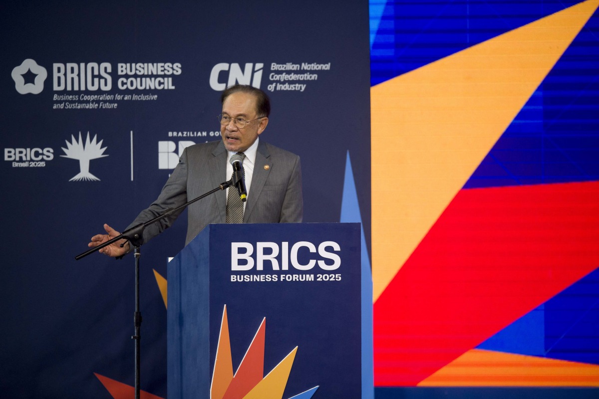 Malaysia's Prime Minister Anwar Ibrahim speaks during the BRICS Business Forum in Rio de Janeiro, Brazil, on July 5, 2025. (Photo by Daniel RAMALHO / AFP)