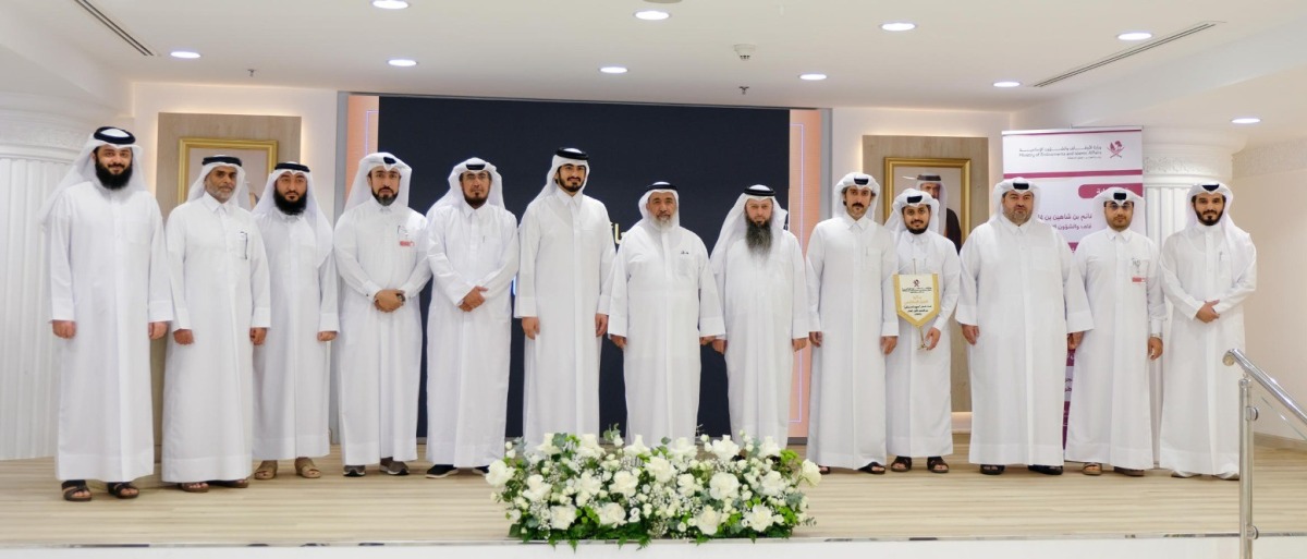 Minister of Awqaf and Islamic Affairs H E Ghanem bin Shaheen bin Ghanem Al Ghanem with honourees and officials during the event.