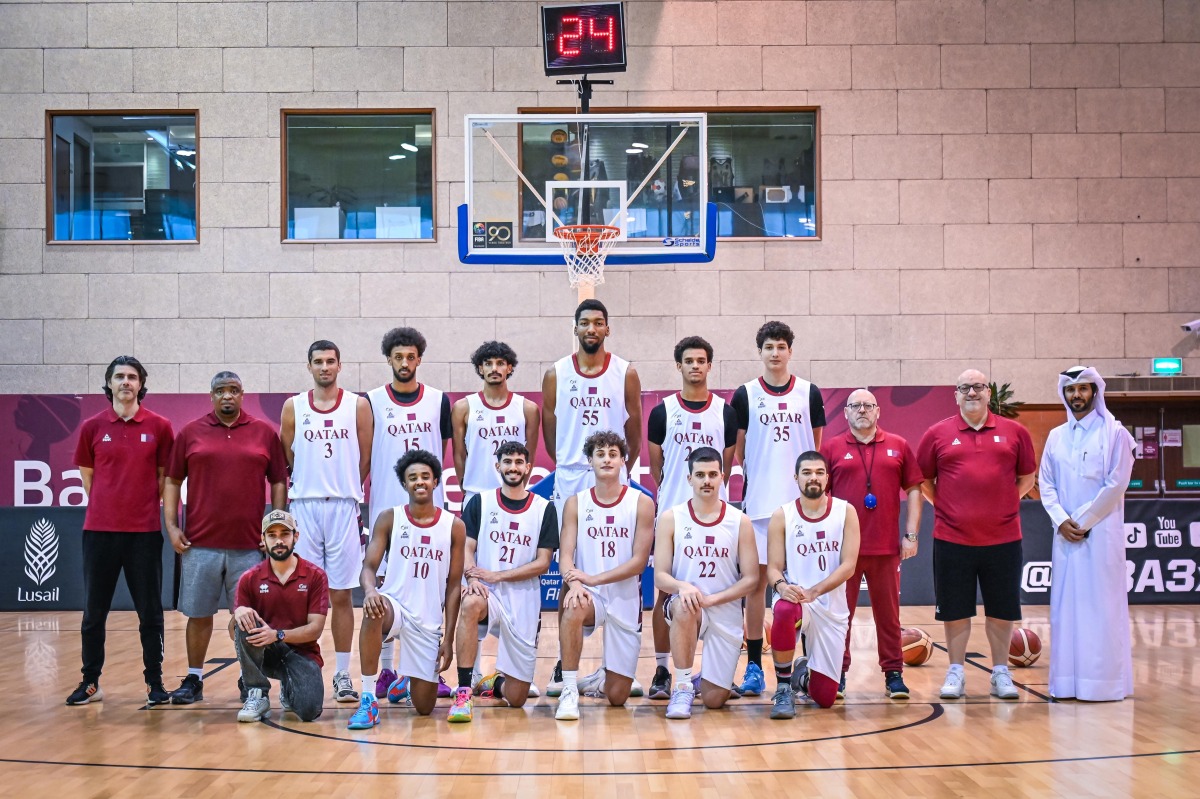 Qatar Reserve Team players and officials pose for a photograph.